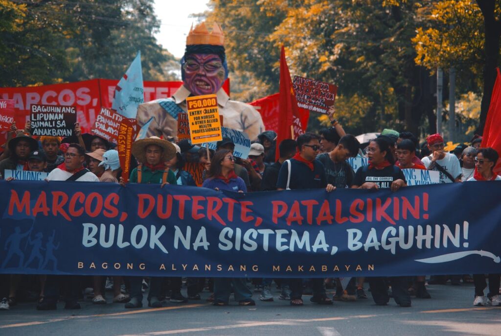 The Art of Drawing Readers In: Your attractive post title goes here Street protest with demonstrators holding political banners and signs demanding change.