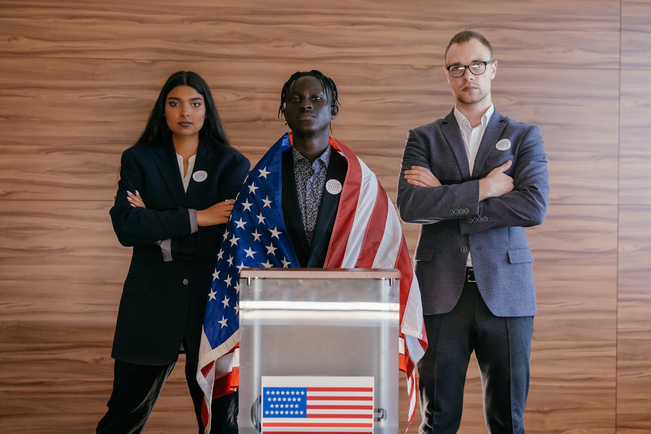 Services Diverse group of political candidates standing with American flag at voting podium.