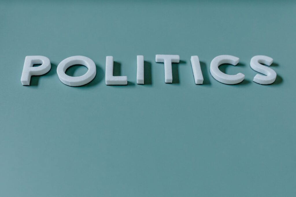 Mastering the First Impression: Your intriguing post title goes here Close-up image of the word 'Politics' against a teal green background, highlighting political themes.